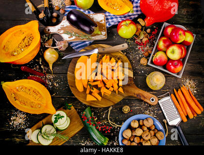 Autumn vegetables and fruits on a dark rustic wooden background. Flat lay Stock Photo