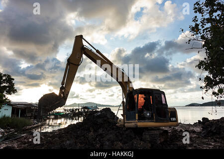 Excavator operator downtime waiting Stock Photo - Alamy