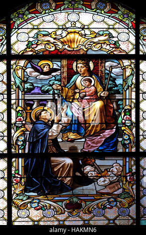 Virgin Mary with baby Jesus and Saint Dominic Stock Photo