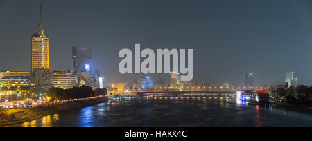 Panoramic night view of Cairo center, the Nile river and the island of Zamalek, in the distance the 6th October bridge and the city skyscrapers. Stock Photo