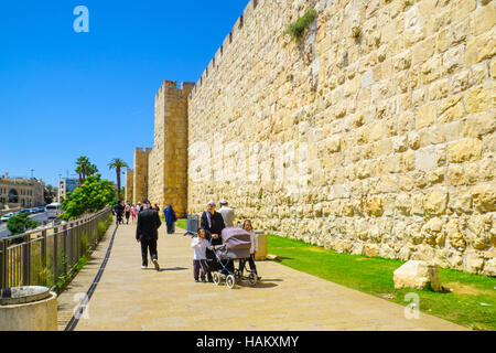 JERUSALEM, ISRAEL - APRIL 29, 2016: Ultra-Orthodox Jews and other visitors, near Jaffa gate, part of the walls of the old city, in Jerusalem, Israel Stock Photo