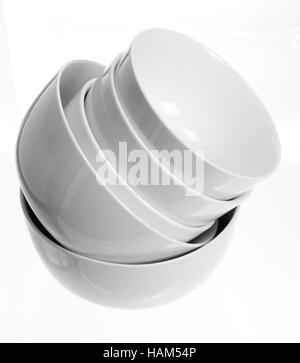 Stack of clean ceramic bowls isolated on white Stock Photo - Alamy
