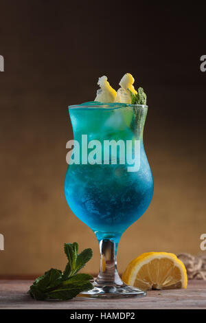 Concept: restaurant menus, healthy eating, homemade, gourmands, gluttony. Blue Lagoon Cocktail on gritty vintage background Stock Photo