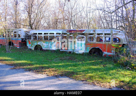 An old city bus is abandoned in a junkyard in Frankfort, Indiana. Stock Photo