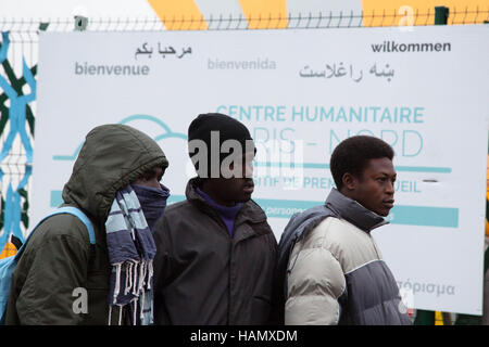 Paris France 2nd December 2016 Migrants from Sudan wait to enter camp for migrants and refugees near Porte De La Chapelle in northern Paris. Credit:  Thabo Jaiyesimi/Alamy Live News Stock Photo