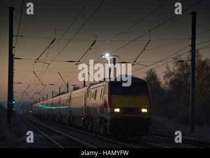 Class 91114 heads north at Conington, Cambridgeshire with a London Kings Cross to Leeds service on 29 November 2016 Stock Photo