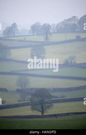 Cool misty conditions over rural farmland in the village of Rhes-y-Cae in Flintshire, North Wales. Stock Photo