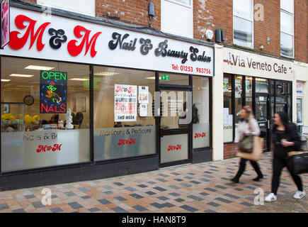 Neon Open sign Nails and People passing Nail Bar & Beauty salon,  in Brierley Street, Blackpool, Lancashire, UK Stock Photo