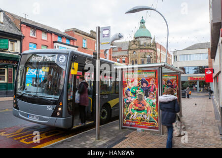 Aladdin Panto   Decorated modern, Bus Shelter, advertising billboard, stop, advertising, poster, urban, empty, public, city, board, transportation, sign, street, placard, road, transport, advertisement, space, panel, roadside, ad, glass, station, commercial, place, marketing banner for Christmas Pantomime, a  Picture Point for the  Grand Theatre, on the streets of Blackpool, Lancashire, UK Stock Photo