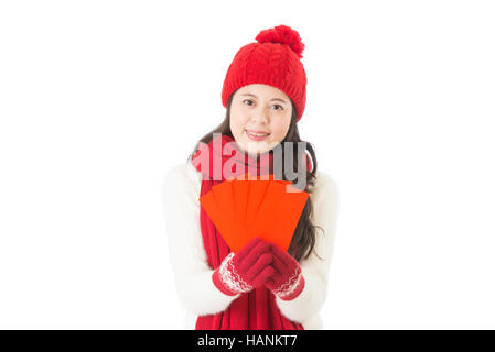 happy chinese new year. smile mixed race asian woman giving red envelope isolated on white background Stock Photo