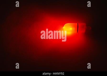 Fishing red LED power indicator isolated on black background Stock Photo