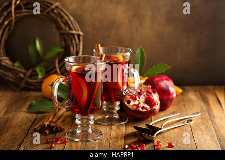 Mulled wine with pomegranate and orange Stock Photo