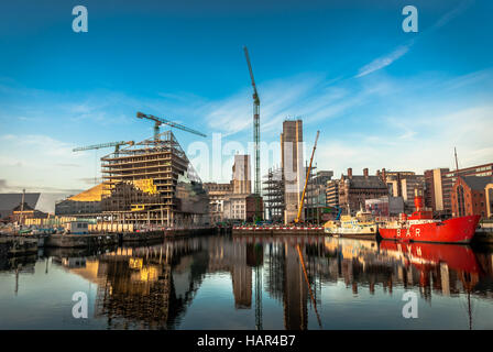Development of new modern buildings on Mann Island, including the RIBA with the Mersey Bar Lightship vessel Planet in the . Stock Photo