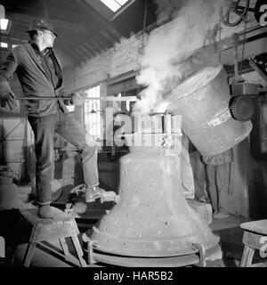 File photo dated 11/03/1965 of a worker pouring bell metal from a ladle into the shape of 'Luke', one of the four bells being cast for Liverpool's new Roman Catholic Cathedral, at the Whitechapel Bell Foundry, London. The foundry, Britain's oldest manufacturing firm, is set to close at its current site, bringing an end to a family business that has run for almost 500 years. Stock Photo