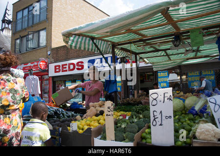 East Street Market in Southwark SE17 London. Market stall selling fresh fruits and vegetables  in the local market, aka the lane Stock Photo