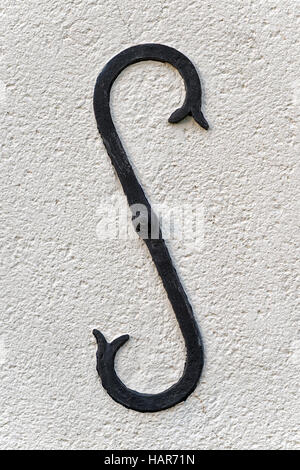 stylized reinforcement anchor plate on a wall Stock Photo