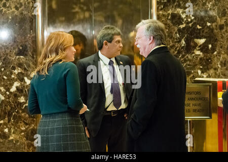 New York, United States. 02nd Dec, 2016. Former US Ambassador to the United Nations John Bolton (right) is seen in the lobby of Trump Tower as he waits for an elevator. Members of President-elect Donald J. Trump's transition team and invited guests were seen passing through the lobby of Trump Tower in New York City where Mr. Trump is holding an ongoing series of meetings regarding the composition of his Presidential cabinet. Credit:  Albin Lohr-Jones/Pacific Press/Alamy Live News Stock Photo