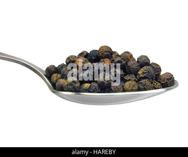 Spoon of black pepper grains, isolated on white, detailed spoonful macro closeup Stock Photo