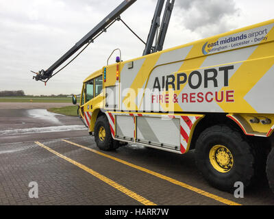 Airport Fire Engine parked infront of the airport fire station at East Midlands Airport with the airport fire logo showing. Stock Photo