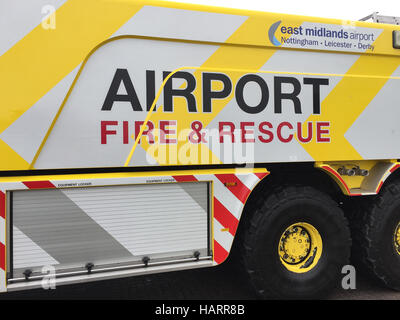 Airport Fire Engine parked infront of the airport fire station at East Midlands Airport with the airport fire logo showing. Stock Photo