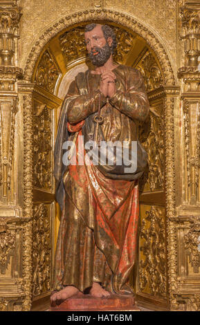 AVILA, SPAIN, APRIL - 19, 2016: The carved polychrome baroque statue of St. Peter on side altar in church Basilica de San Vicente Stock Photo