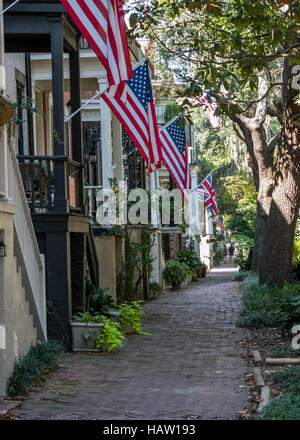 Flags on Jones Street in Savannah's historic residential district Stock Photo