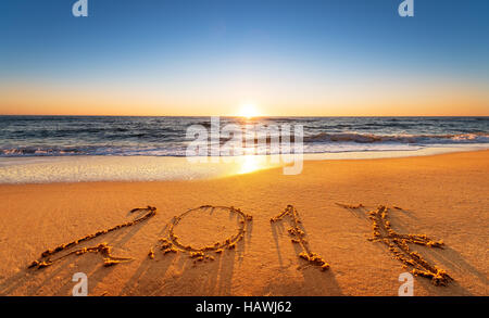 2017 written on seashore sand at sunrise. Stock Photo