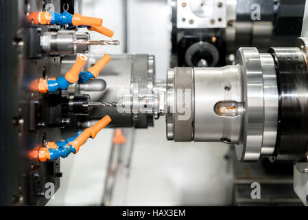 Operator machining mold and die part for automotive industrial working in factory. Stock Photo