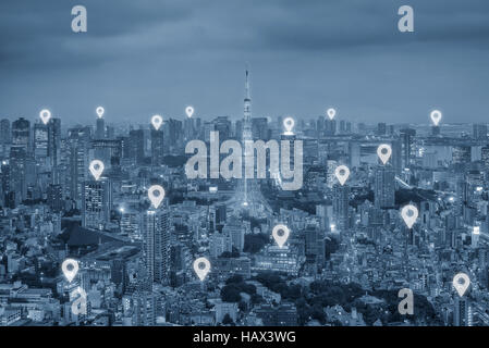 Map pin flat above Tokyo city scape and network connection concept. Tokyo smart city. Stock Photo