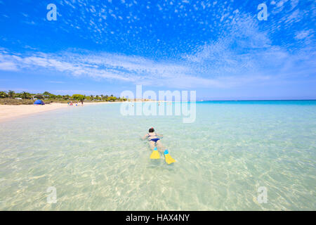 A woman snorkeling in the clear, shallow waters at Coral Bay. Western Australia Stock Photo