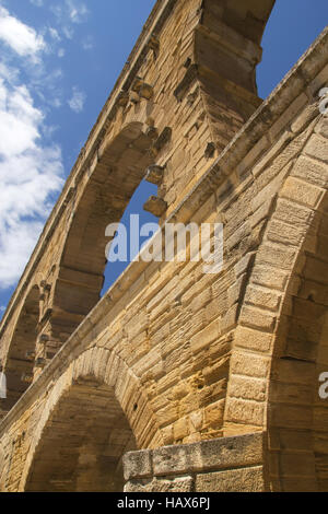 The Pont du Gard is an ancient Roman aqueduct bridge that crosses the Gardon River in southern France Stock Photo