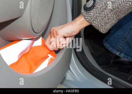 reflective vest in car door Stock Photo