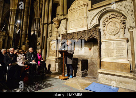 Grayson Perry reads a poem close to the memorial stone to poet Philip Larkin after it was unveiled in Poet's Corner in Westminster Abbey, central London. PRESS ASSOCIATION Photo Picture date: Friday December 2 2016. Photo credit should read: John Stillwell/PA W Stock Photo