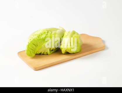 Fresh little gem lettuce heads on cutting board Stock Photo