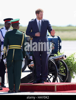 Prince Harry is given a guard of honour as he prepares to leave Grantley Adams International Airport in Barbados as he heads to Guyana, as part of his tour of the Caribbean. Stock Photo