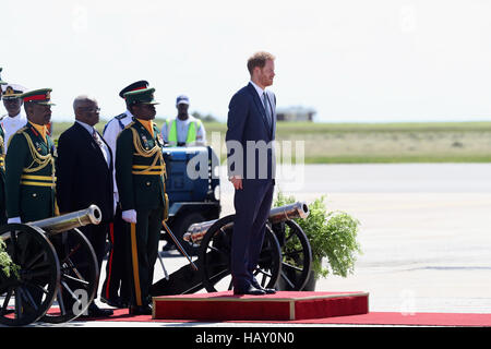 Prince Harry is given a guard of honour as he prepares to leave Grantley Adams International Airport in Barbados as he heads to Guyana, as part of his tour of the Caribbean. Stock Photo