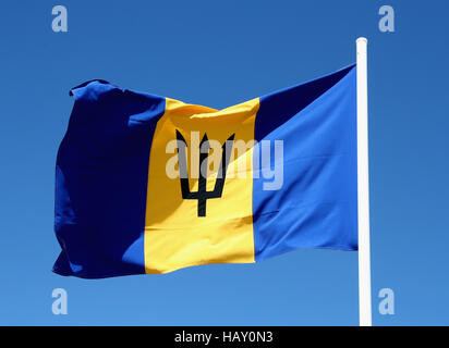 The flag of Barbados flutters in a breeze as Prince Harry prepares to leave Grantley Adams International Airport in Barbados as he heads to Guyana, as part of his tour of the Caribbean. Stock Photo