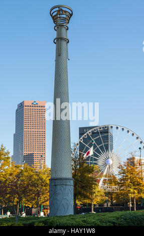 Column and SkyView Ferris wheel at Centennial Olympic Park in downtown Atlanta, Georgia, USA. Stock Photo