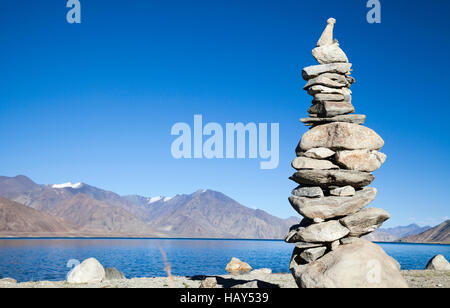 Stone cairn or chorten on the Indian side of Pangong Tso Lake situated on the Indian Chinese border in Ladakh Stock Photo