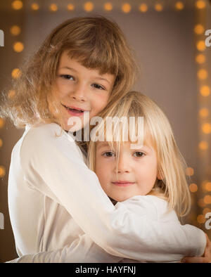 Two girls hugging each other Stock Photo