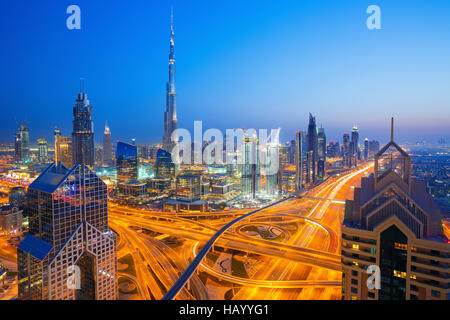 View on modern skyscrapers and busy evening highways in luxury Dubai city,Dubai,United Arab Emirates Stock Photo