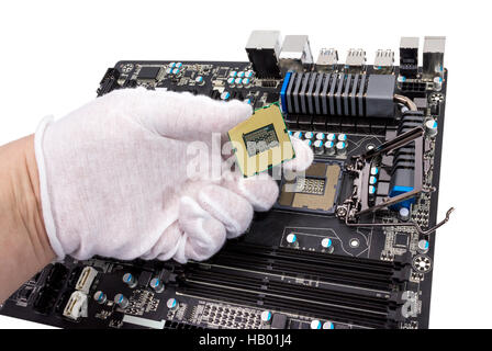 Installation of modern processor in CPU socket Stock Photo