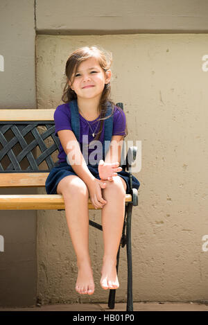 Little Girl on Bench Stock Photo