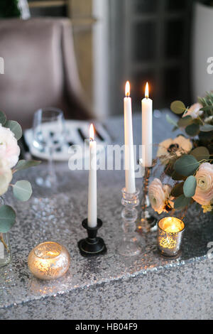 Wedding decor.  interior. Festive . The burning candles on a table. Stock Photo