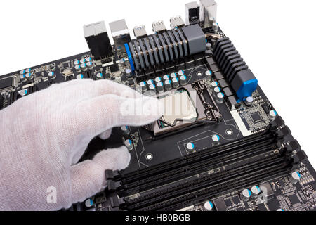 Installation of modern processor in CPU socket Stock Photo