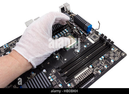 Installation of modern processor in CPU socket Stock Photo