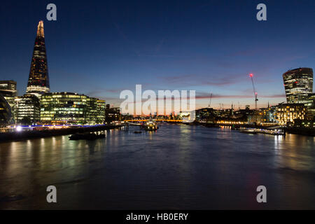 Night London cityscape with River Thames, Walkie Talkie, (20 Fenchurch Street) and the Shard (32 London Bridge Street) landmark buildings prominent. Stock Photo