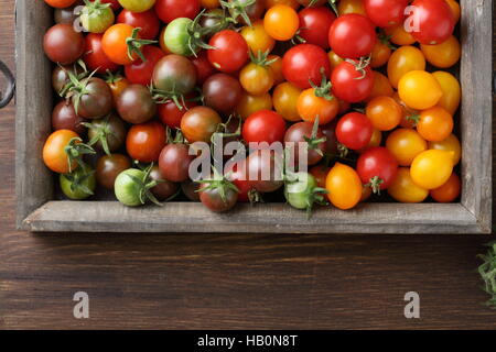 Ripe Cherry tomatoes on wood, food above Stock Photo