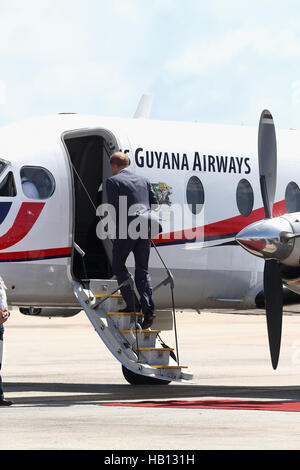 BRIDGETOWN, BARBADOS - DECEMBER 02: Prince Harry is given a guard of honour as he prepares to leave Grantley Adams International Airport to head to the final leg of his tour, Guyana, on day 12 of an official visit to the Caribbean on December 2, 2016 in Bridgetown, Barbados. Prince Harry's visit to The Caribbean marks the 35th Anniversary of Independence in Antigua and Barbuda and the 50th Anniversary of Independence in Barbados and Guyana. (Photo by Chris Jackson/Getty Images) Stock Photo