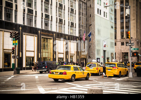 View of Fifth Avenue in Manhattan New York City with yellow taxicabs and Bergdorf Goodman Department Store in view Stock Photo